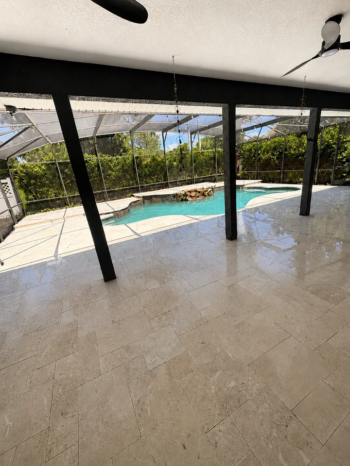 Front steps of poured concrete finished with large porcelain paver treads and stucco side walls
